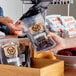 A person holding a package of Weaver's Chopped and Formed Turkey Jerky.