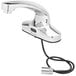 A close-up of a chrome T&S hands-free sensor faucet.