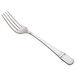 An Oneida Astragal stainless steel table fork with a silver handle.