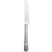 A silver steak knife with a white handle on a white background.