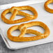 Dutch Country Foods Pennsylvania Dutch soft pretzels on a baking sheet.