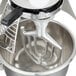 A silver Globe mixer flat beater inside a metal bowl.