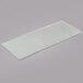 An Avantco glass shelf for bakery displays on a gray surface.