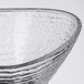 An Arcoroc glass bowl with a wavy design.