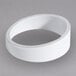 A white circular melamine riser with a hole in the middle.
