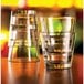 A stack of Arcoroc customizable double old fashioned glasses with a liquid in one glass.