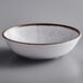 A white Elite Global Solutions melamine bowl with a brown rim.