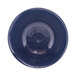 A white melamine bowl with a dark blue rim.