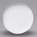 A white Elite Global Solutions melamine plate with a spiral design.