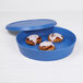A blue lid for an Elite Global Solutions Bento Box with food inside.