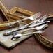 Oneida Michelangelo stainless steel spoons on a table with other silverware.
