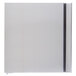 The bottom half of a stainless steel refrigerator with a left hinged door open.