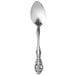 A Oneida Michelangelo stainless steel demitasse spoon with an ornate handle.