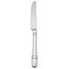 A silver Oneida table knife with a curved edge.