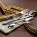 Oneida Michelangelo stainless steel teaspoons on a table with other silverware.