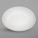 An off white Elite Global Solutions deep oval melamine plate with a rim.