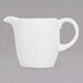 A white pitcher with a handle.
