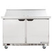 A stainless steel 48-inch two-door mega top ADA height refrigerated sandwich prep table with a raised ingredient rail and casters.