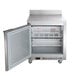 A Beverage-Air stainless steel worktop freezer with a door open.