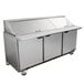 A Beverage-Air stainless steel 3 door refrigerated sandwich prep table.