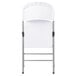 A white Lancaster Table & Seating folding chair with metal legs.