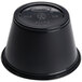 A black plastic Dart souffle container with a lid.