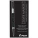 A close-up of a Pilot silver marker pen with a white barrel and brush tip.