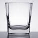 A close up of a Libbey Quartet rocks glass with a square bottom.