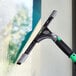 An Unger ErgoTec Ninja window cleaner with a green handle and aluminum squeegee channel.