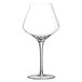 A close-up of a clear Chef & Sommelier Intense wine glass with a stem.