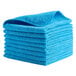 A stack of blue Rubbermaid microfiber towels.