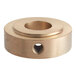 A brass Hobart Thrust Bearing with a hole in the center.