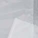 A white LK Packaging plastic food bag with a white paper inside.