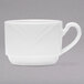 An Arcoroc white porcelain coffee cup with a handle.