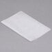 A piece of Durable Packaging interfolded white wax paper on a gray surface.