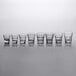 A row of Anchor Hocking New Orleans tall rocks glasses.