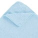 A light blue microfiber cloth with a white edge.