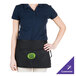 A woman wearing a black Chef Revival waist apron with a green logo.