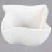An American Metalcraft Prestige white porcelain bowl with a curved edge.