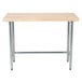 An Advance Tabco wood top work table with a galvanized metal base.