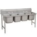 A stainless steel Advance Tabco four compartment sink.