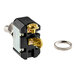 A small black toggle switch with a gold ring.