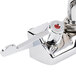 A chrome Equip by T&S wall mount swivel faucet with wrist action handles.