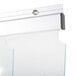 A Norlake Kold Locker strip curtain hanging on a metal frame.