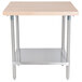 An Advance Tabco wood top work table with a stainless steel base and undershelf.