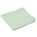 A green Rubbermaid microfiber cloth on a white background.