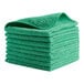 A stack of green Rubbermaid HYGEN microfiber cloths.