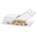 A clear Cal-Mil rectangular tray cover with food inside on a bakery display counter.