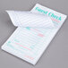 A Royal Paper Mexican Themed white guest check pad with writing on it.