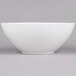 A close-up of a white Arcoroc Vintage bowl with a white rim.